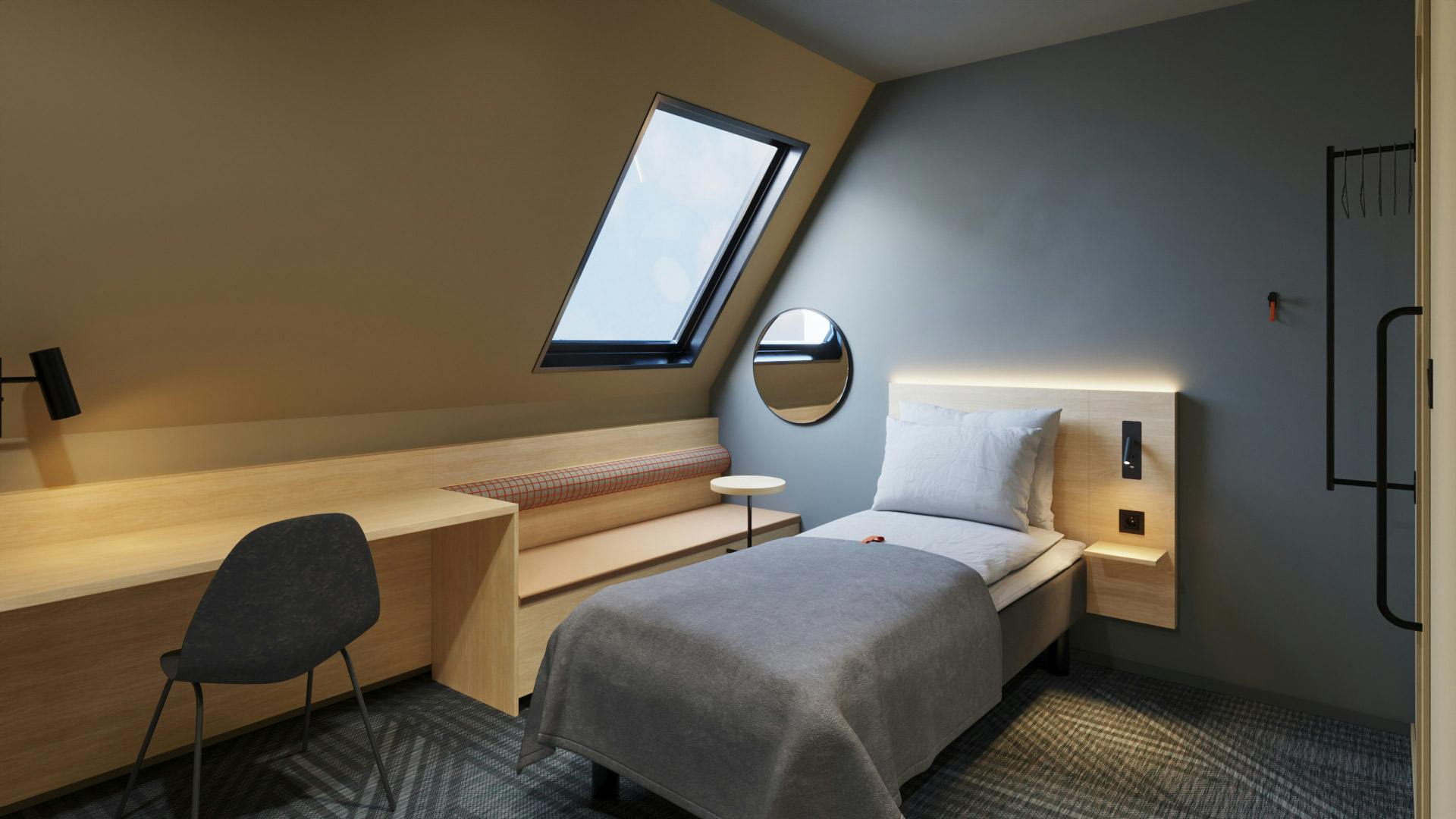Single room in Citybox Brussels. Single bed with seating area, chair and desk.